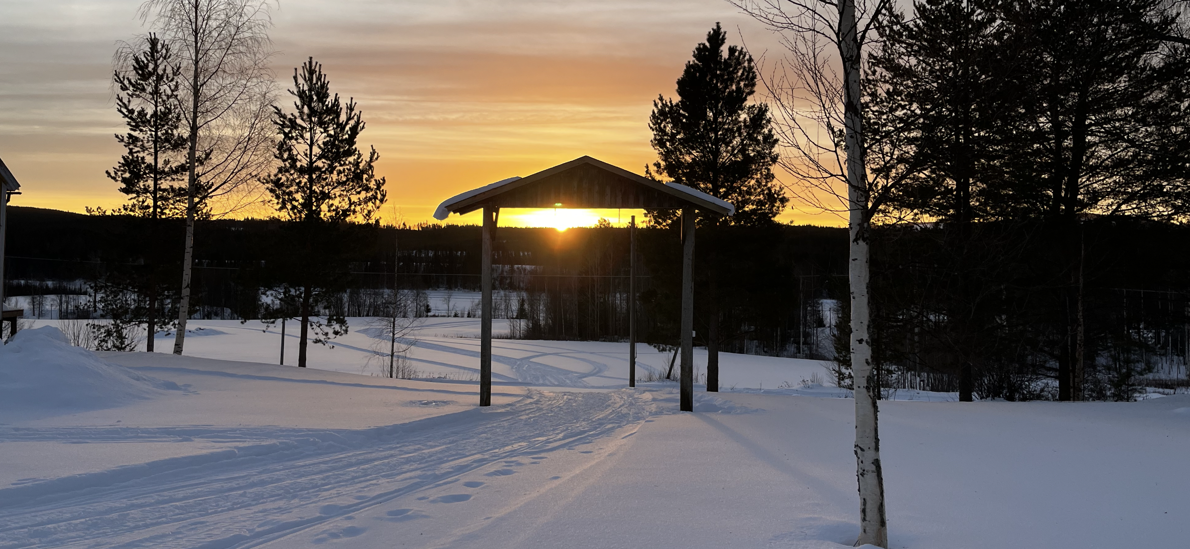 Snöig solnedgång i Strycksele